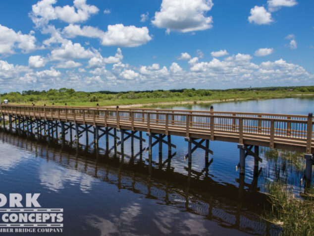 Ave Maria University Pedestrian Bridge - Ave Maria, FL | York Bridge Concepts - Timber Bridge Builders