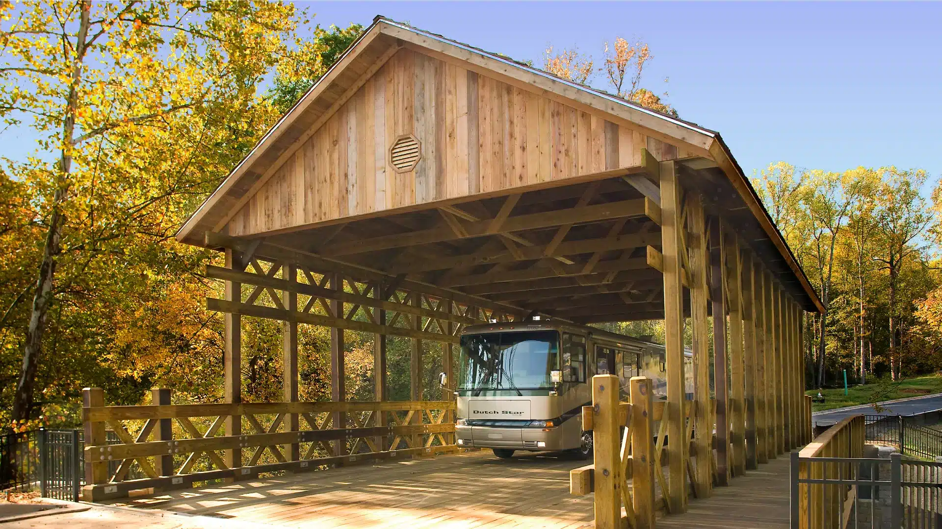 Woodbridge Double Lane Covered Timber Bridge with RV crossing it, built by York Bridge Concepts in Georgia