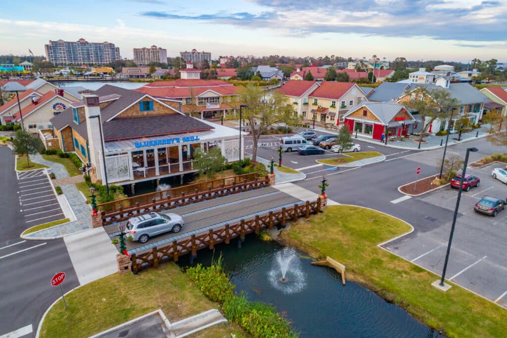 Aerial footage of the timber vehicular bridge at Barefoot Landing in North Myrtle Beach, SC built by York Bridge Concepts