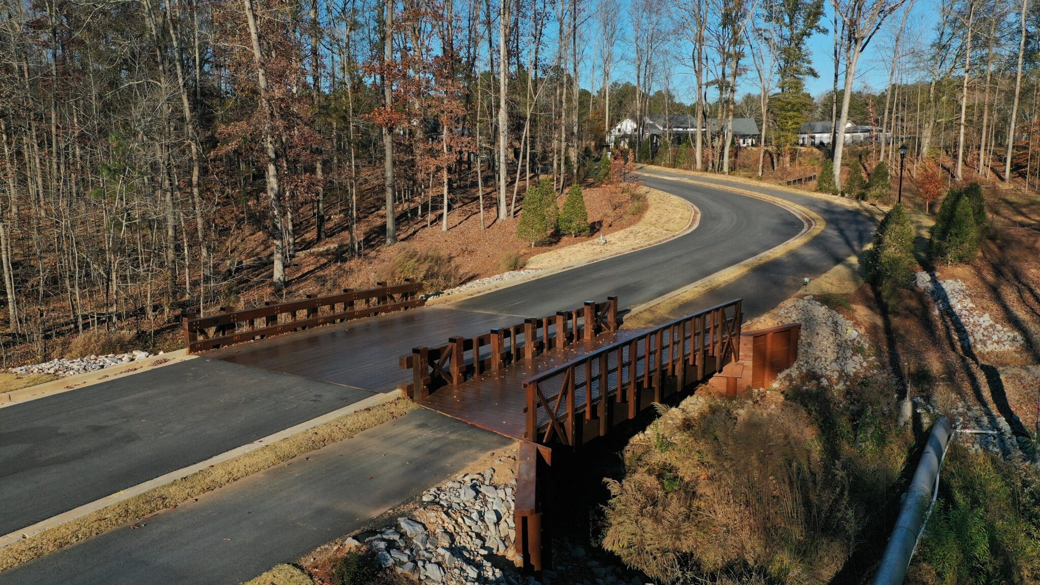 Cresswind at Twin Lakes aerial view of vehicular timber bridge