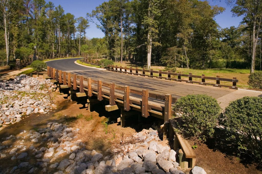 Scenic integration with the Woodland Creek Vehicular Timber Bridge built by York Bridge Concepts in Montgomery, AL