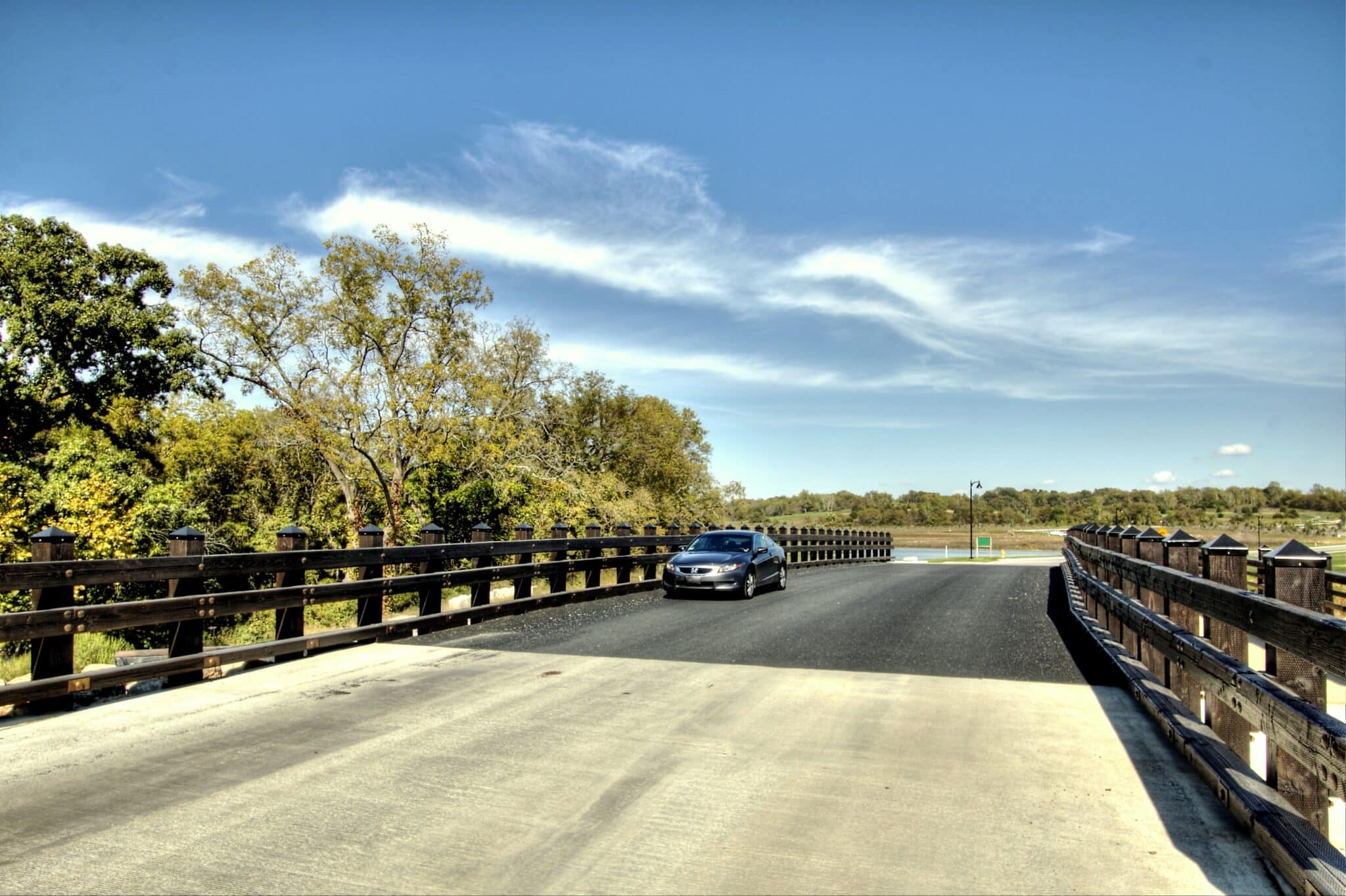 Loch Lloyd vehicular bridge with car passing over