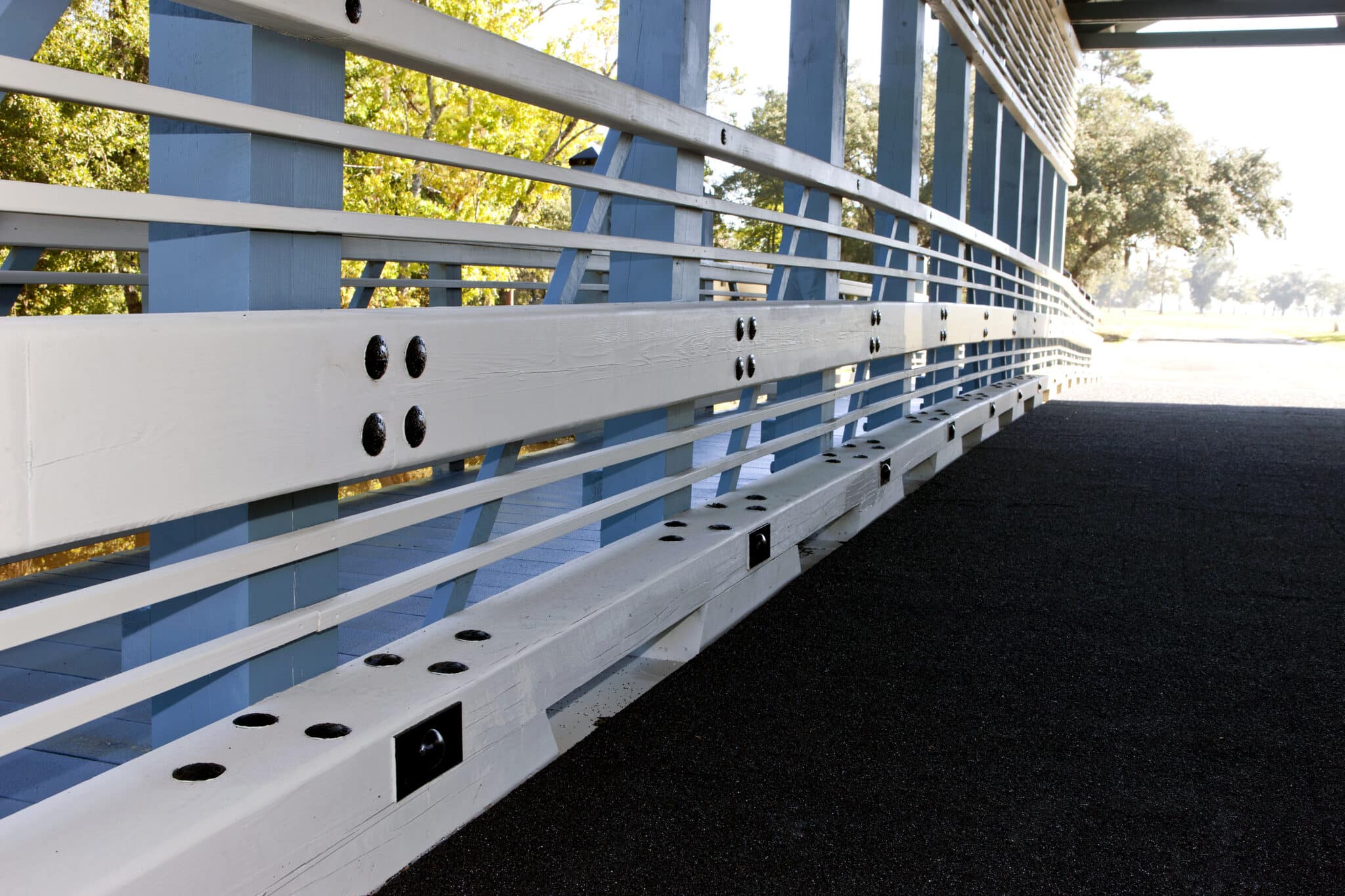 Curb railing for The Plantation At Winyah Bay covered timber vehicular bridge in Georgetown, SC