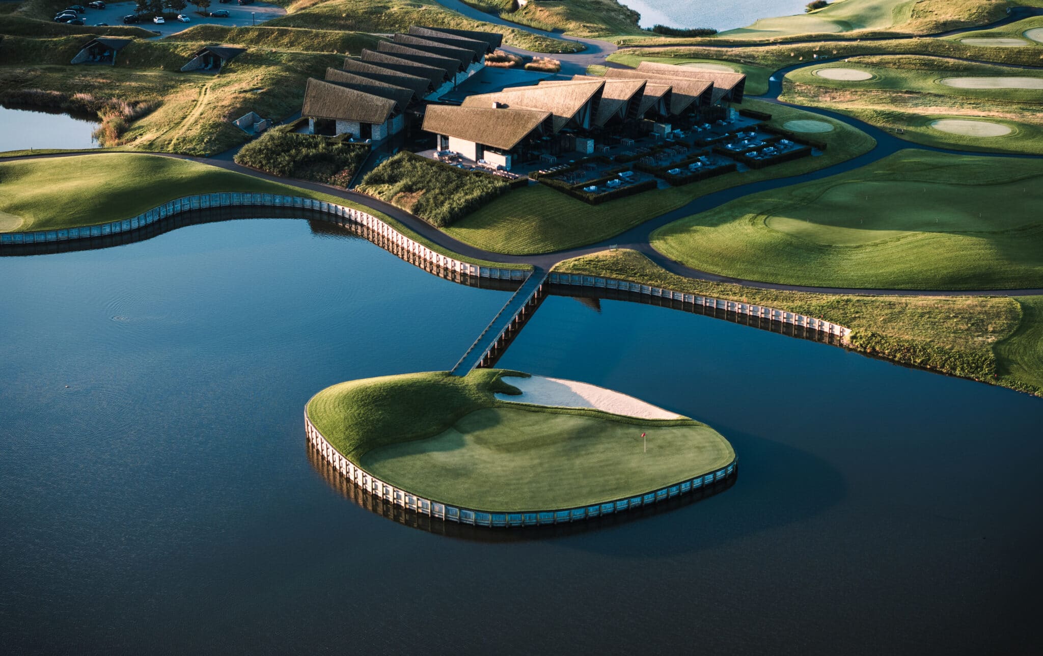 Great Northern Clubhouse and final hole with golf cart bridge in Denmark Built by York Bridge Concepts