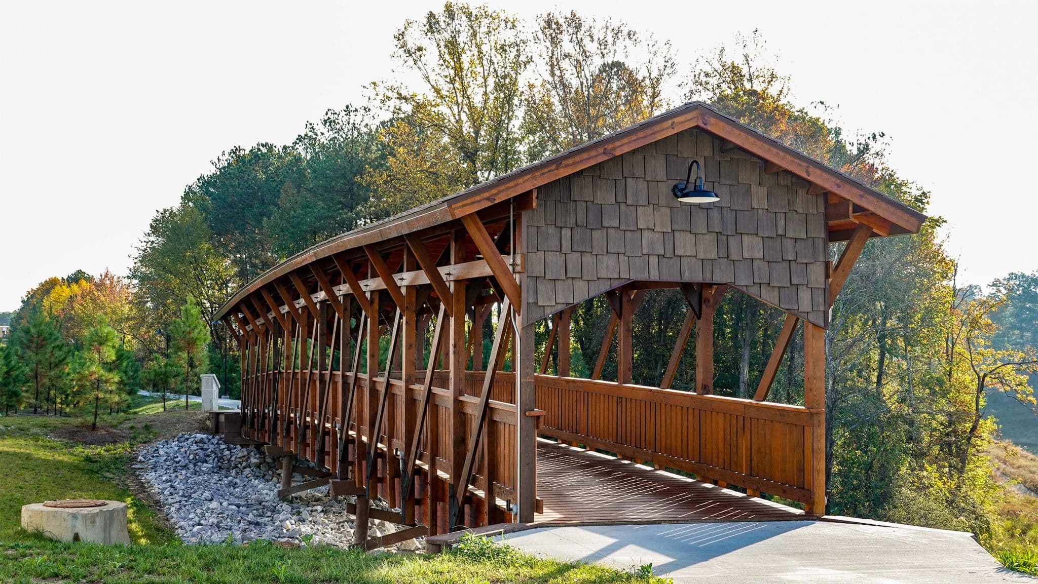 Assembly Studios entryway quarter profile view of the covered timber pedestrian bridge built by York Bridge Concepts in Atlanta, GA