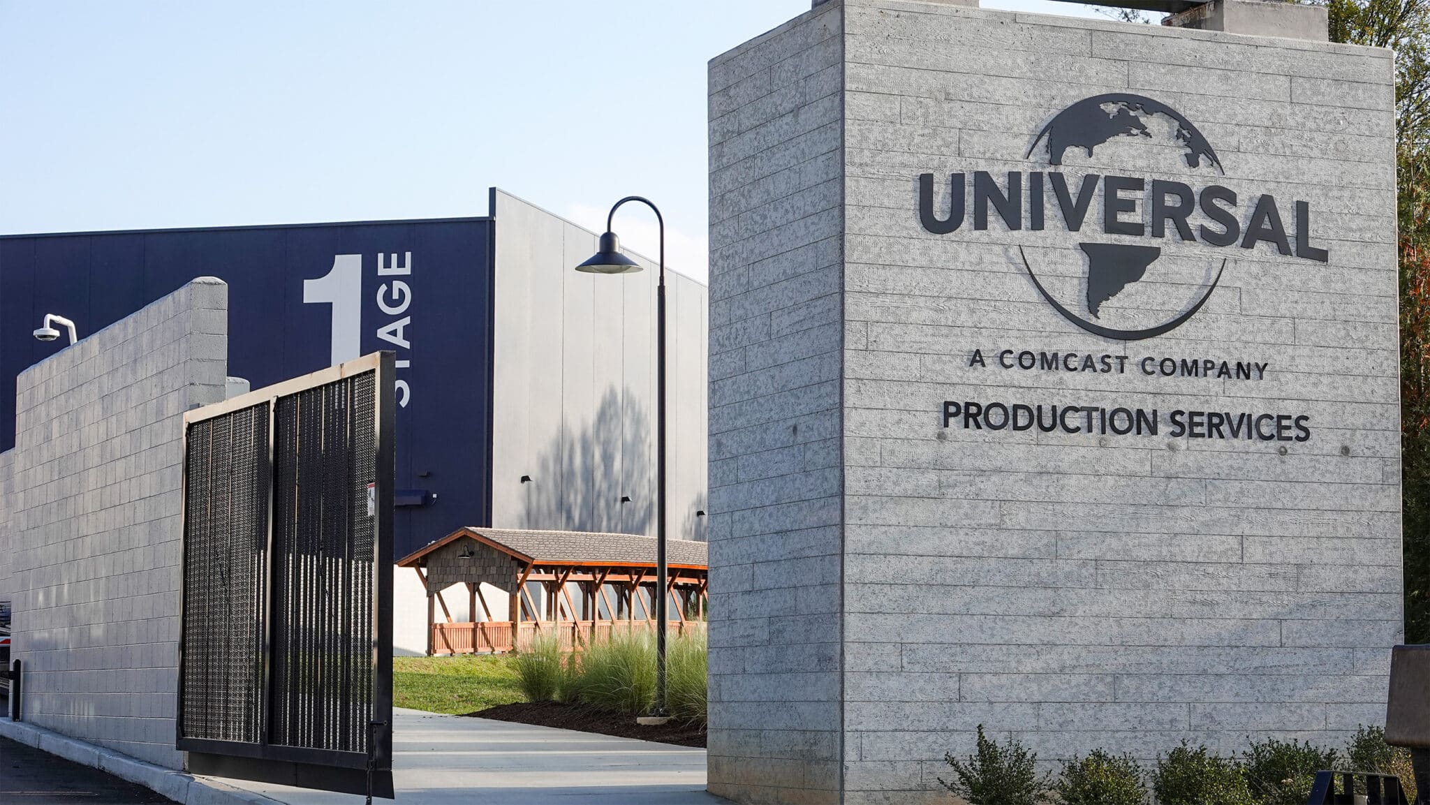 Assembly Studios signage with covered timber pedestrian bridge in Atlanta, GA