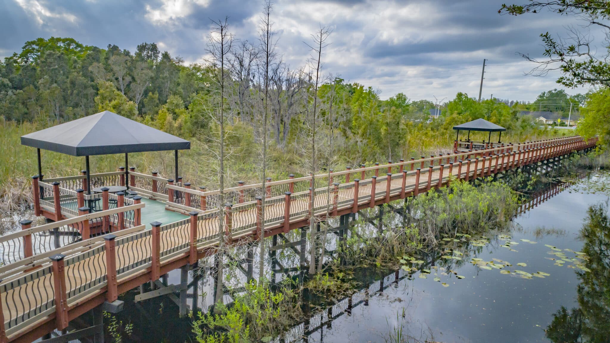 Sienna Village boardwalk with bump out gazebos over wetlands built by York Bridge Concepts