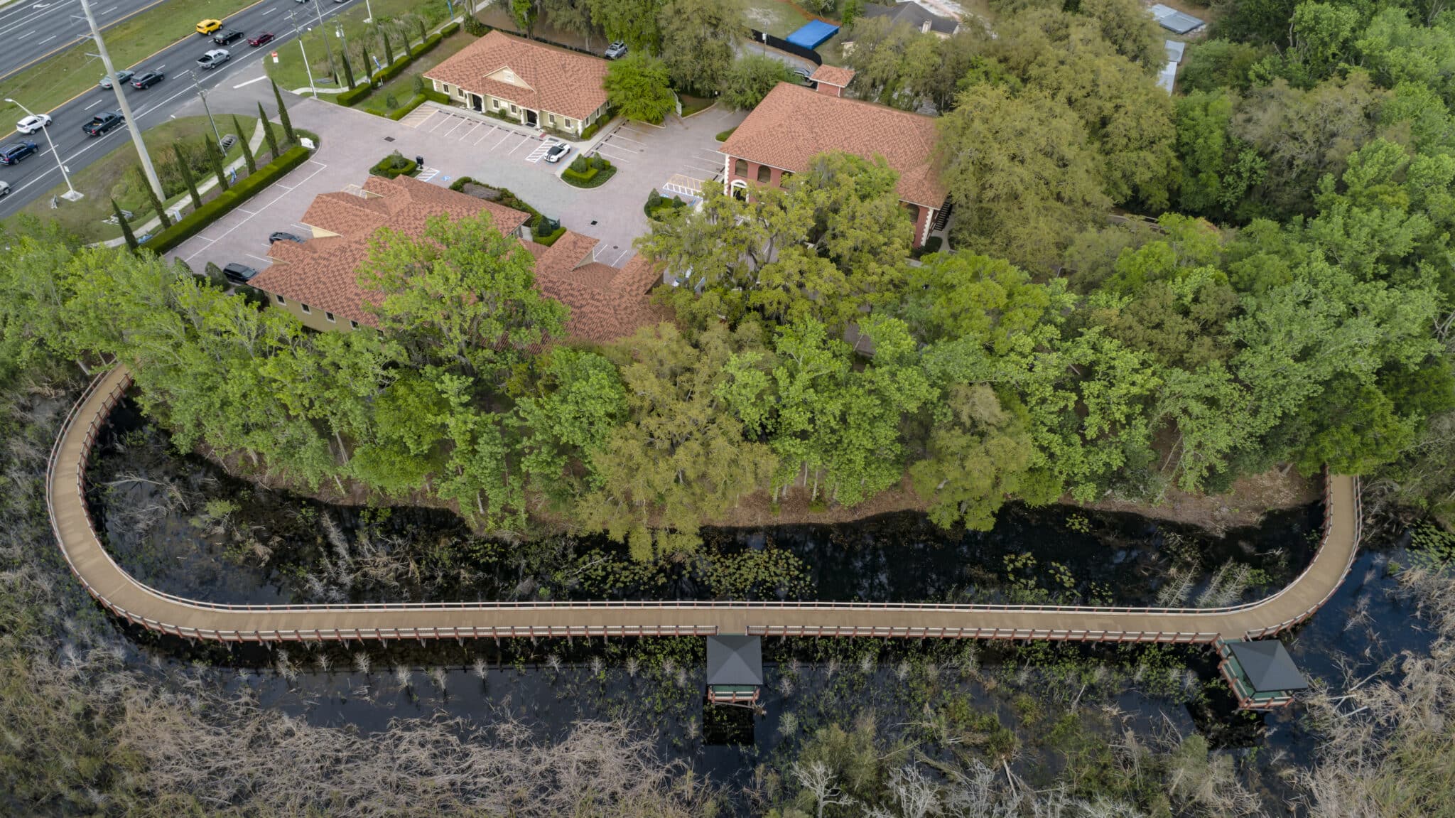 Sienna Village Covered Timber Boardwalk aerial over wetlands design-built by york bridge concepts in tampa, fl