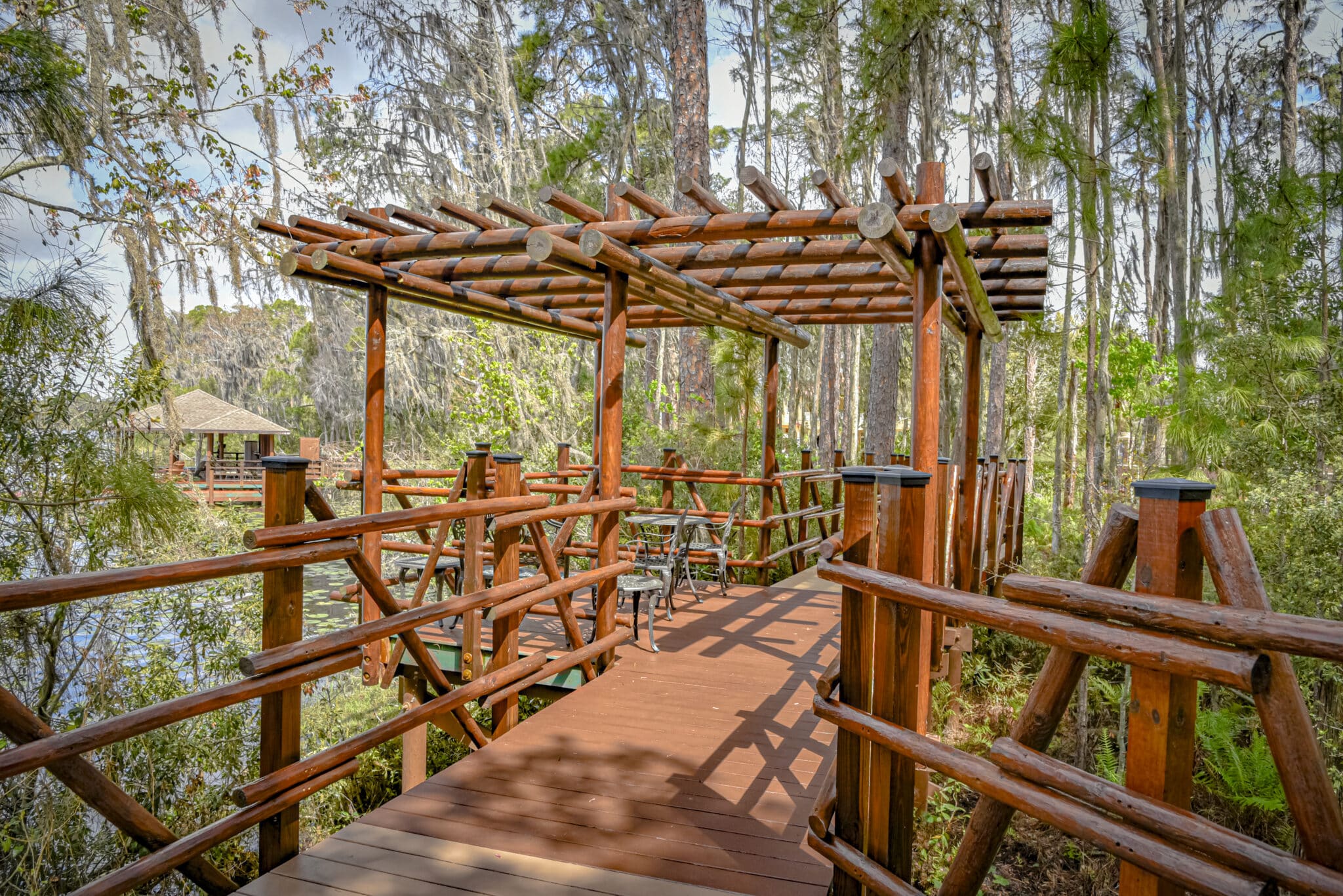 lakes edge boardwalk with pergola on boardwalk.